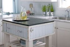 11 a farmhouse kitchen island in white and blue with drawers and a shelf for a coastal farmhouse kitchen