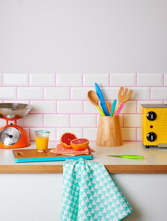 Spruce up your usual white subway tiles with hot pink grout to make it look more playful
