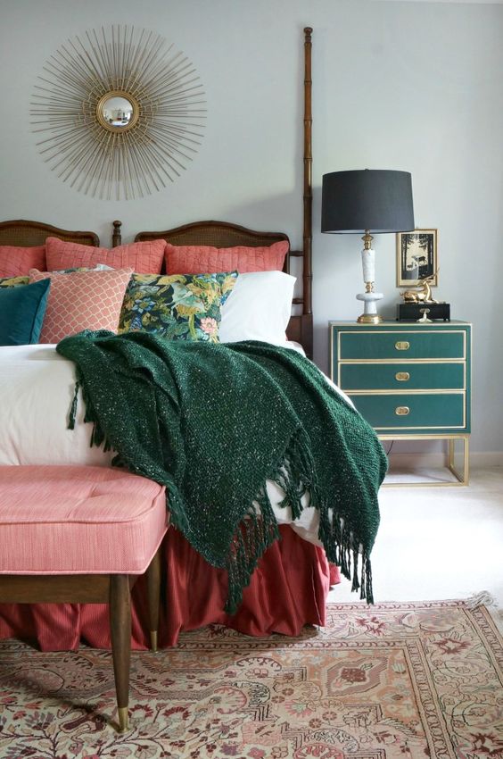 a chic art deco green and gold nightstand and a matching comfy blanket