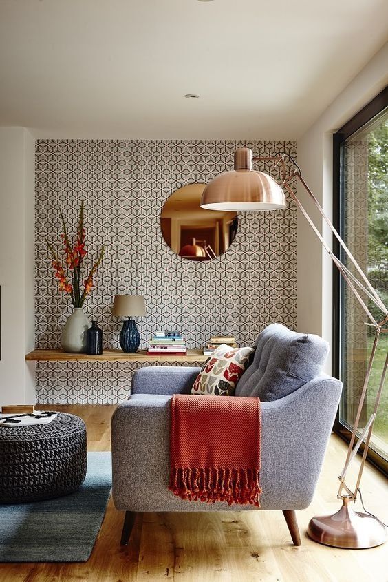 a retro metallic floor lamp with a large lampshade is ideal for reading and creating a cozy ambience