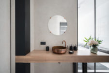 13 The chic wooden vanity is spruce dup with a copper sink and faucet