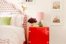 13 a bright red nightstand and a red floral print upholstered bed for a cute touch