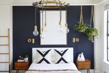 13 a navy statement wall and gilded touches create a very chic and bold space with a boho feel