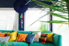 13 an assortment of bright and colorful pillows makes the living room lively and bold
