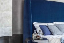 14 a bold blue upholstered bed with a tall curved headboard is a chic idea for a contemporary space
