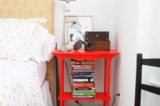 14 a bright red nightstand matches the bedroom style but adds a touch of super bold color