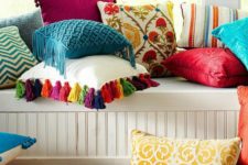 14 some bold pillows and a bright faux fur throw can completely change a neutral space