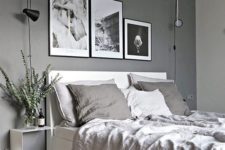 15 a bedroom in various grey shades with a black and white gallery wall for a bold touch