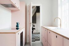 15 a chic girlish kitchen with simple blush cabinets and a grey tiled floor