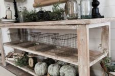 15 a farmhouse whitewashed console with green whitewashed pumpkins, greenery, wire baskets and lamps