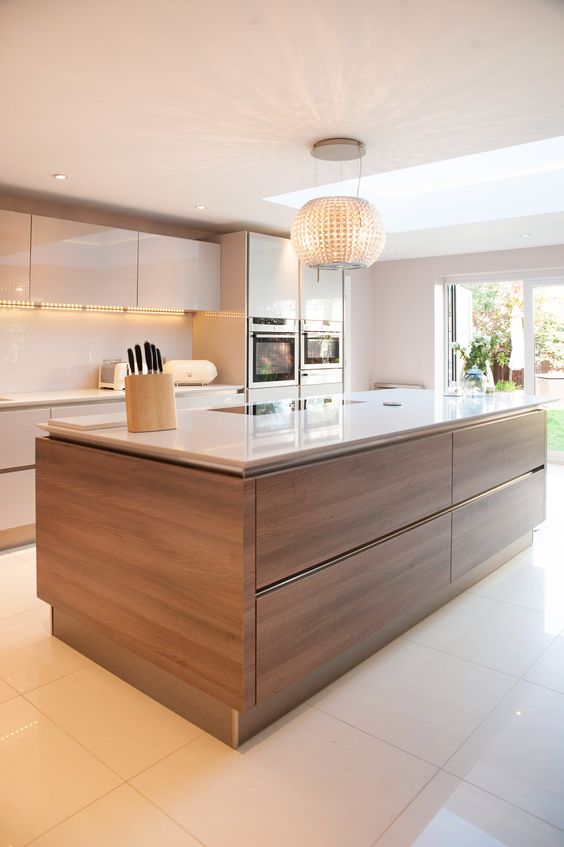 a neutral glam kitchen with a wood clad kitchen island to add texture and interest to the space