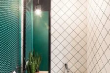 15 an emerald wall, white tiles with emerald grout and emerald framing of the vanity for a wow look