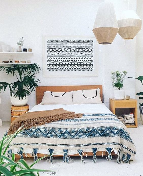 straw pendant lamps, printed textiles, fringe and potted greenery for a slight boho feel