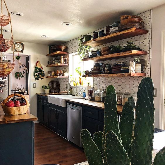 wooden shelves and wicker baskets plus potted cacti and greenery for a relaxed look
