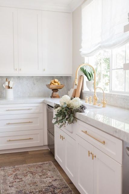 add a touch of glam to a usual plain kitchen rocking gold handles and fixtures