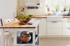 17 a small farmhouse kitchen island with plenty of storage and a meal space is a practical idea