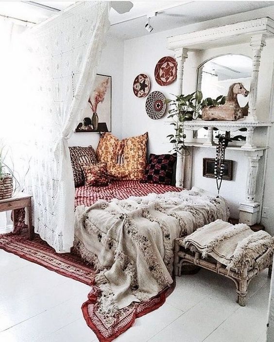 boho textiles, fringe, colorful baskets on the wall and alace curtain for an ultimate boho look