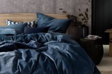 19 a bedding set in the muted shades of blue spruces up the space done in neutrals