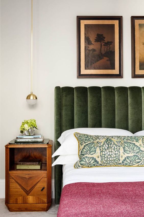 an earthy green upholstered bed is a color statement and a cozy piece for sleeping
