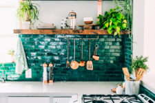 20 a gorgeous emerald tile backsplash and wooden shelves make up a stunning setup for a boho kitchen