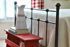 20 a simple red bench at the footrest is a creative idea for storage and adding a farmhouse feel