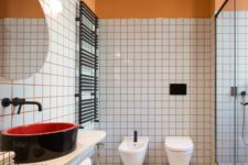 20 spruce up your bathroom with colorful grout like here with orange grout and orange half walls