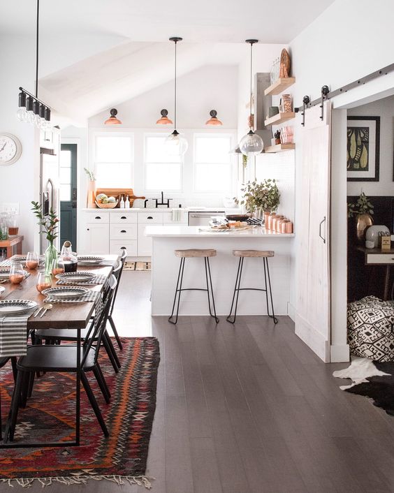 Copper touches and boho textiles are a bold and cool idea for a kitchen dining space layout