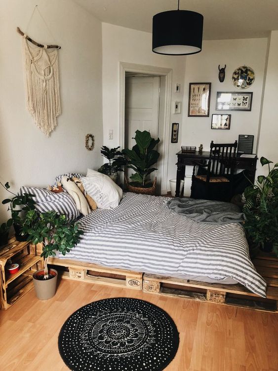a macrame wall hanging, potted greenery and a boho rug are all you need for a boho chic feel