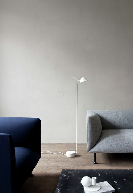 a minimalist white floor lamp with a small lampshade is great for reading