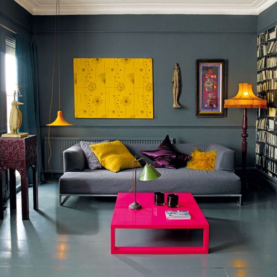 bright yellow, hot pink and deep purple accents in a grey room make it stand out