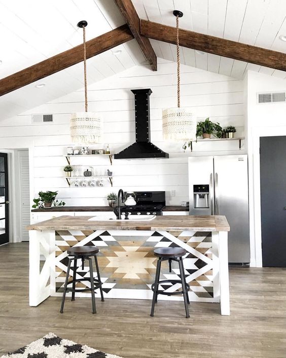 macrame lampshades, a mosaic kitchen island and wooden beams for a relaxed modern boho look