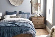 24 a stylish blue and grey bedding set, a blue and white rug are echoing with subtle lilac walls