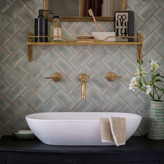 make your bathroom wow with pattern clad tiles and brass grout plus brass fixtures and shelves