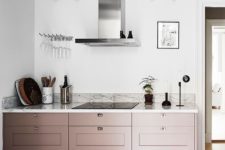 24 pale pink cabinets for adding a tender touch of color to the neutral kitchen