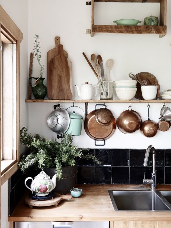 wooden details, potted greenery and copper pots for a stylish boho feel