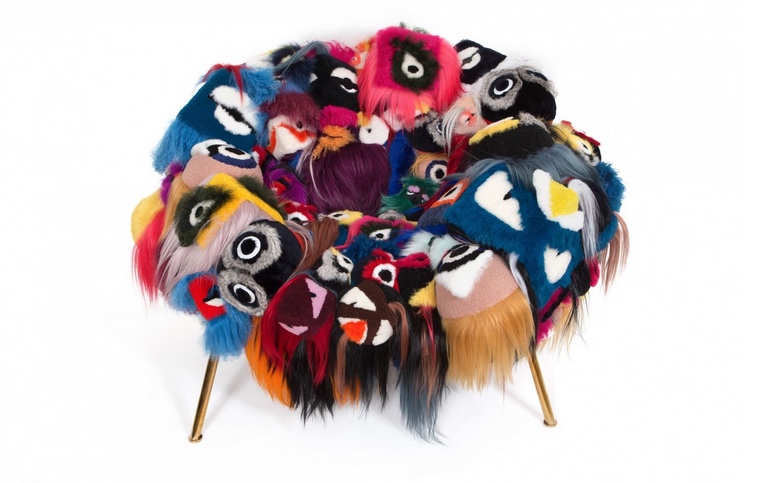 The Armchair of Thousand Eyes is a unique furniture item made of Fendi bags and it looks like a monster
