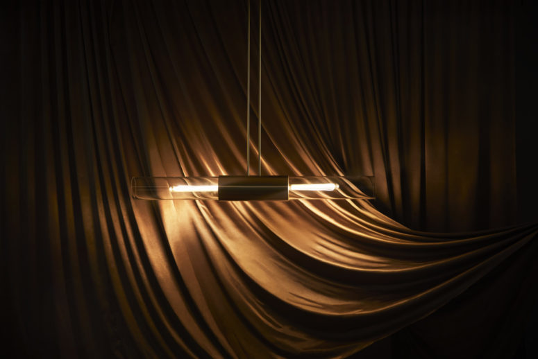 The Glimpse pendant lamp is a horizontal feature inspired by the sunlight streaming across the horizon