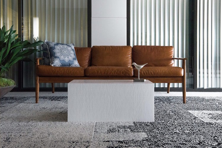 The coffee table is a long cube, which is very cofy in using and will easily fit a modern space