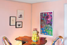 02 The dining room is super colorful, with bold chairs, an artwork, a pendant lamp and look at these table legs