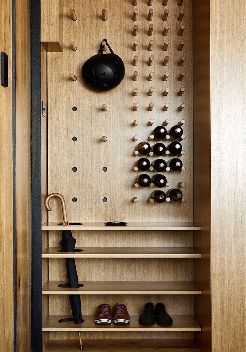 The entryway unit features a pegboard and some shelves