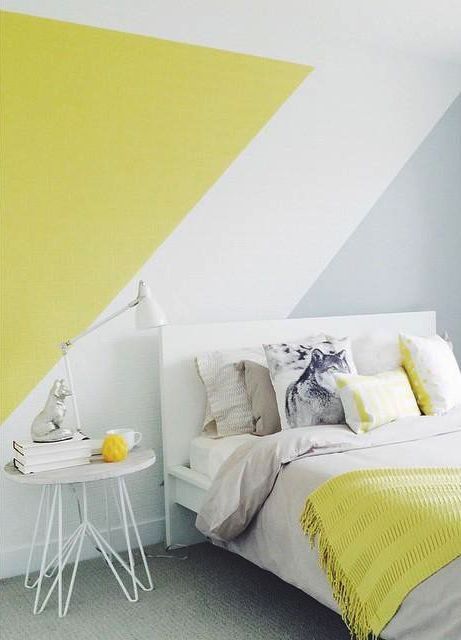a color block wall in grey, white and mustard and a matching bedding set for more brightness