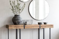 02 a duo of round mirrors in simple frames for a boho chic entryway