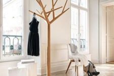 02 a wood and metal coat rack imitating a real tree is a fresh idea for a modern entryway