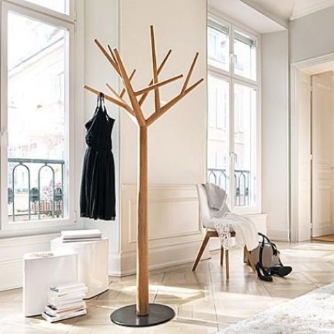 a wood and metal coat rack imitating a real tree is a fresh idea for a modern entryway