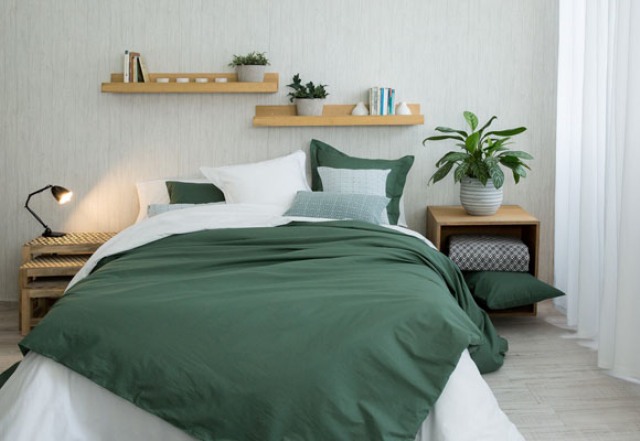 If you like bold colors, try a white and emeralf bedding set with a contrast