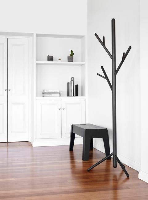 a black metal stem coat stand is right what you need for a minimalist space, spruce it up with its original design