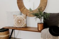03 a large round mirror clad with wood is ideal for a rustic or boho chic space, it will add coziness