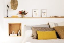 03 a mustard pillow and blanket make a bold colorful statement and add cheerfulness to the space