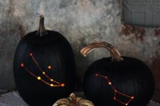03 stylish black drilled pumpkins with lights inside instead of usual spooky carved ones
