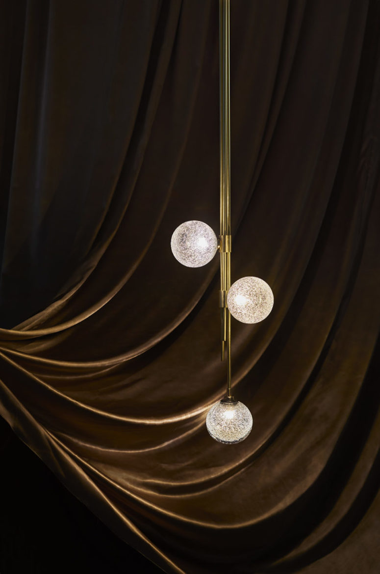 The Trilogy pendant light features three glass spheres that look really intricate and catchy